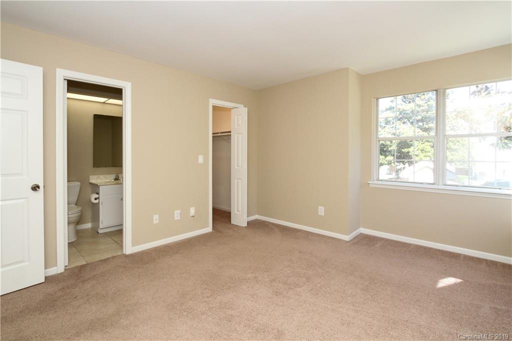 7825 Renaissance Court, Unit B Charlotte, NC 28226 - Photo 10 of 21 a view of an empty room with a window