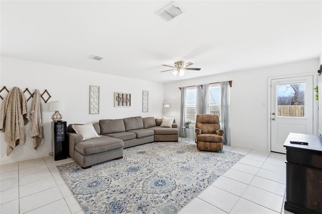 312 Ranchito Pass Fort Worth, TX 76052 - Photo 12 of 30 Living room featuring a ceiling fan, wine cooler, and light tile patterned floors