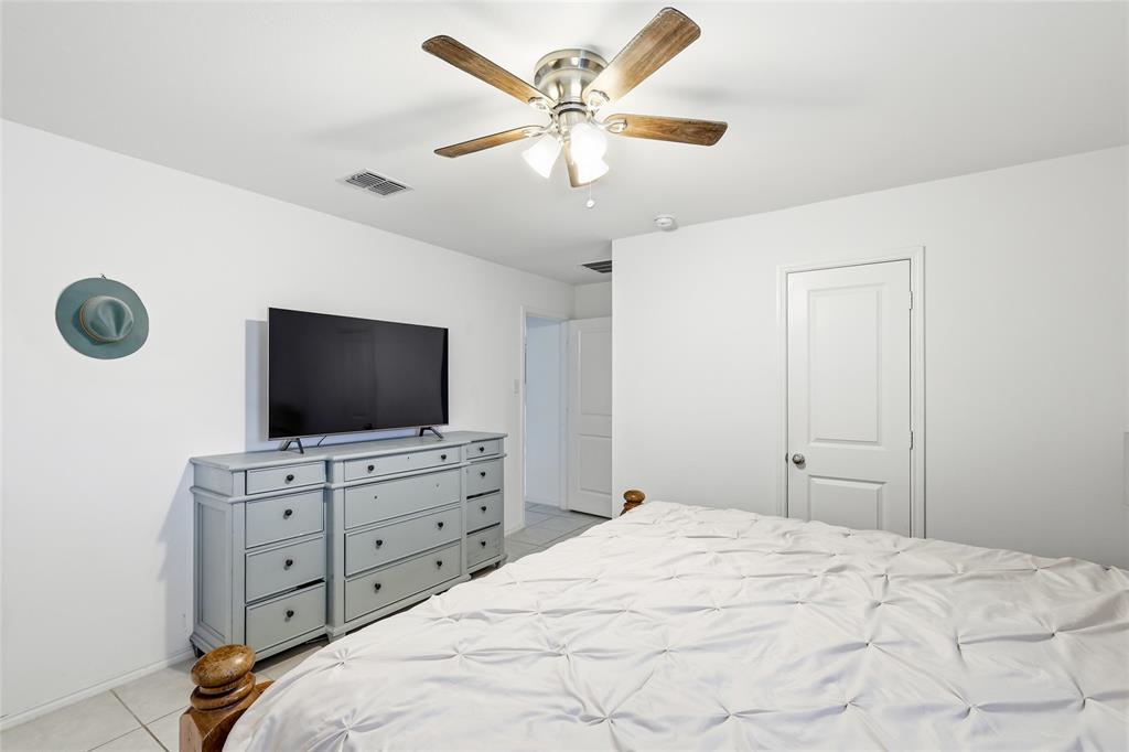312 Ranchito Pass Fort Worth, TX 76052 - Photo 21 of 30 Bedroom featuring a ceiling fan and light tile patterned floors