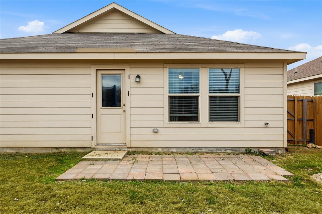 312 Ranchito Pass Fort Worth, TX 76052 - Photo 29 of 30 Back of house with roof with shingles and a patio