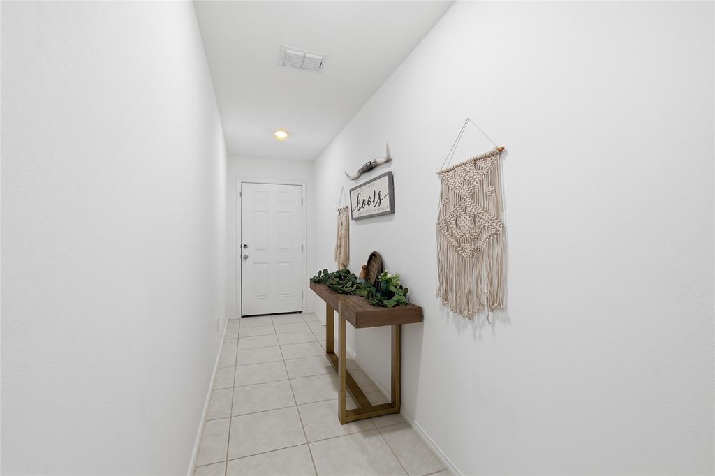312 Ranchito Pass Fort Worth, TX 76052 - Photo 5 of 30 Corridor with baseboards and light tile patterned floors
