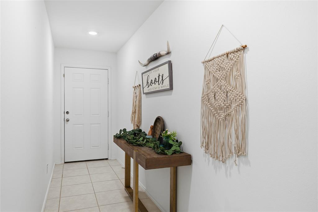 312 Ranchito Pass Fort Worth, TX 76052 - Photo 6 of 30 Doorway featuring tile patterned flooring and baseboards