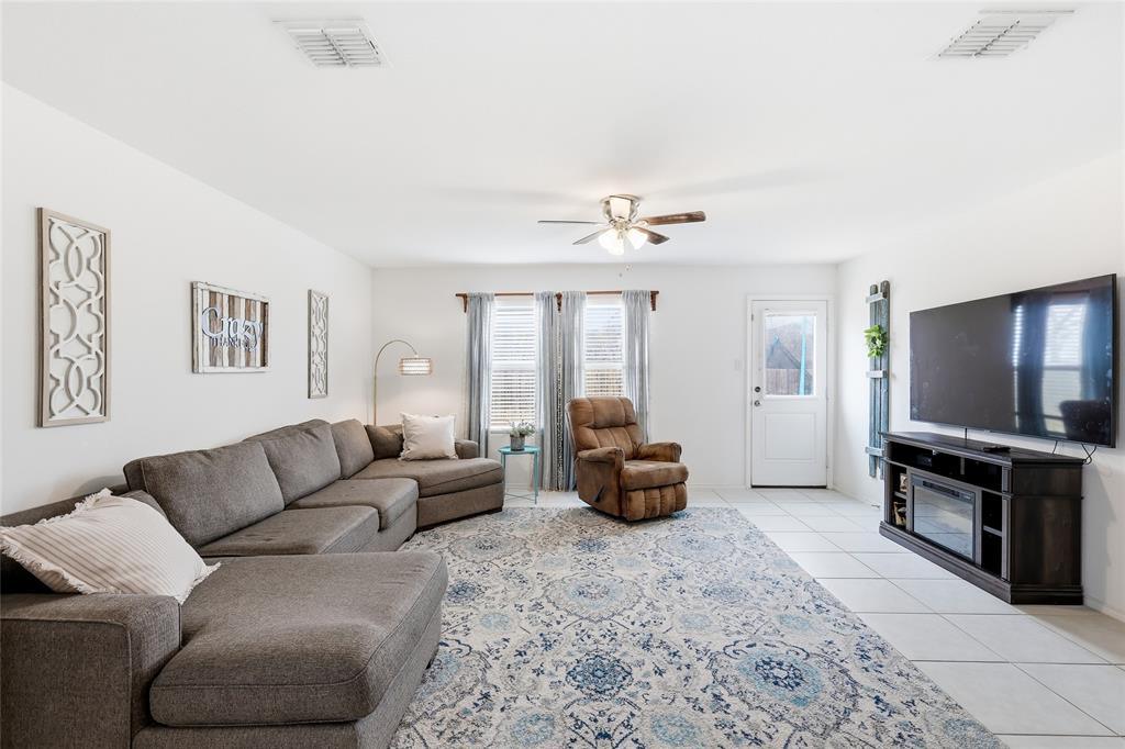 312 Ranchito Pass Fort Worth, TX 76052 - Photo 9 of 30 Living area featuring ceiling fan and light tile patterned flooring