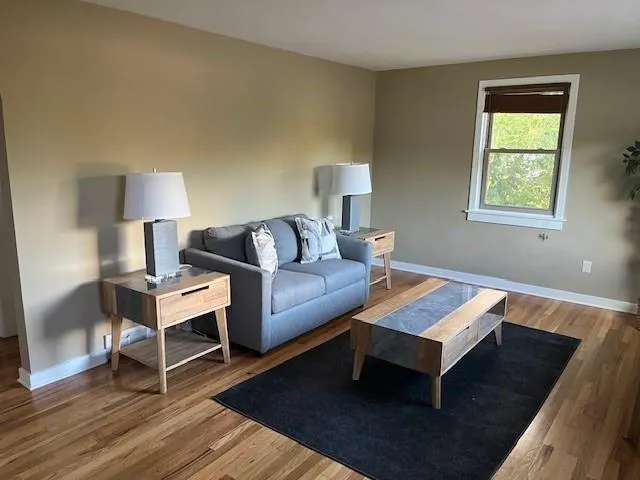 a bedroom with a bed and a lamp