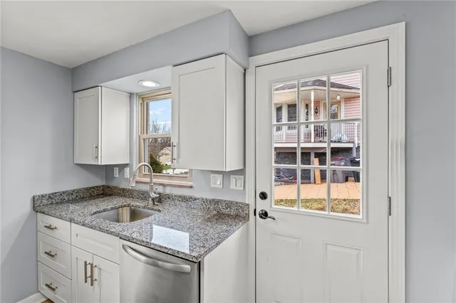 a kitchen with stainless steel appliances a sink stove and refrigerator