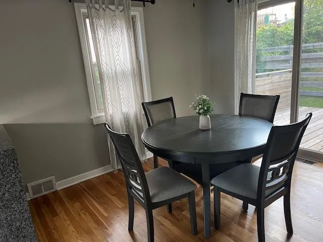 a bedroom with a bed and a mirror on dresser