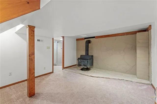 a bathroom with a shower sink mirror and toilet