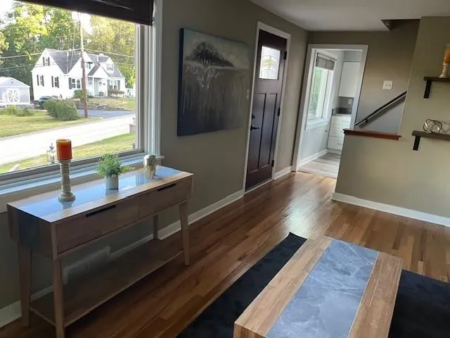 a living room with furniture and a lamp