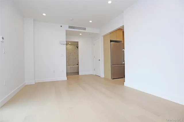 a bathroom with a granite countertop shower a mirror and bathtub