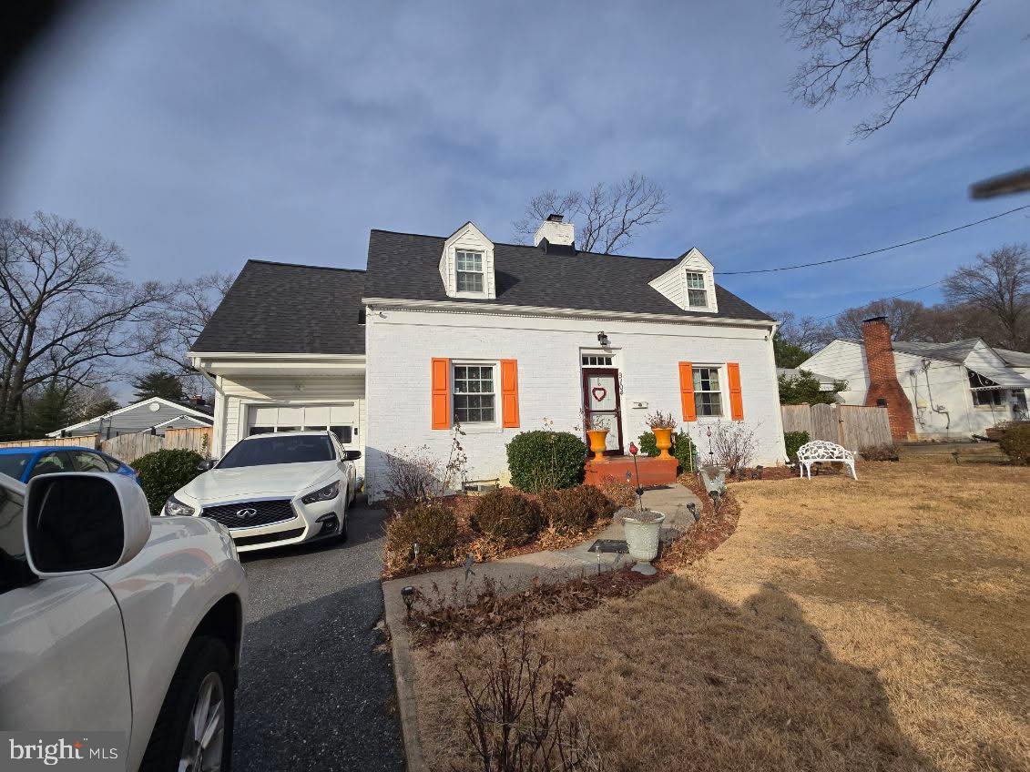 a front view of a house with parking space