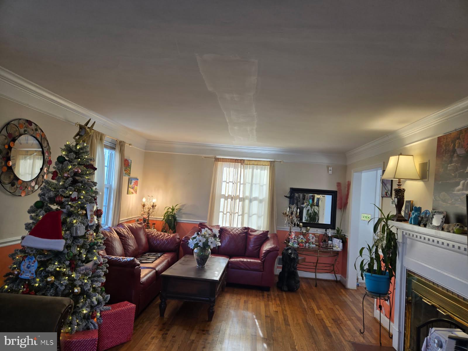 9104 8th Street Lanham, MD 20706 - Photo 3 of 4 a living room with furniture fireplace and a flat screen tv