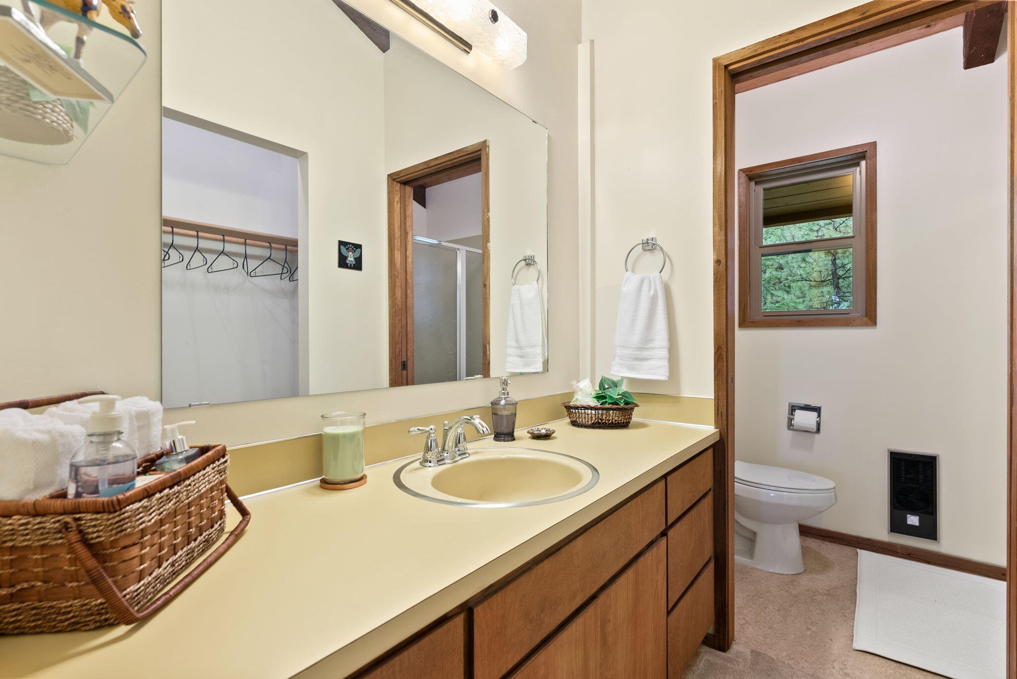 13251 Snowbrush, Unit GH 266 Black Butte Ranch, OR 97759 - Photo 17 of 37 a bathroom with a granite countertop sink mirror and a toilet