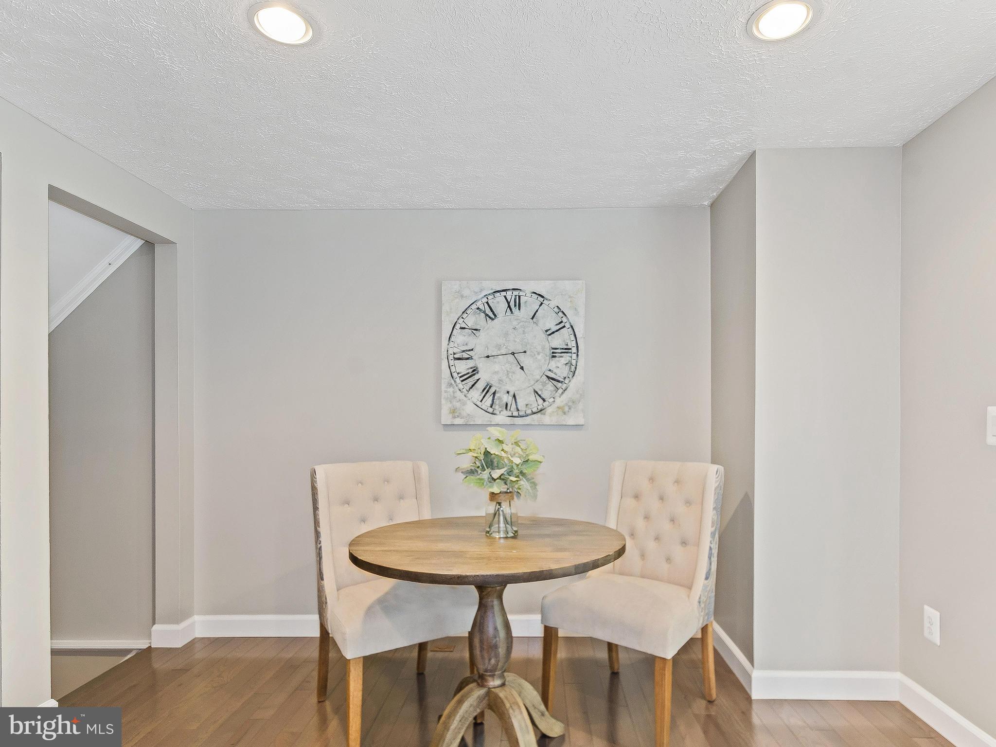 1931 Sagewood Lane Reston, VA 20191 - Photo 14 of 30 a view of a dining room with furniture and wooden floor