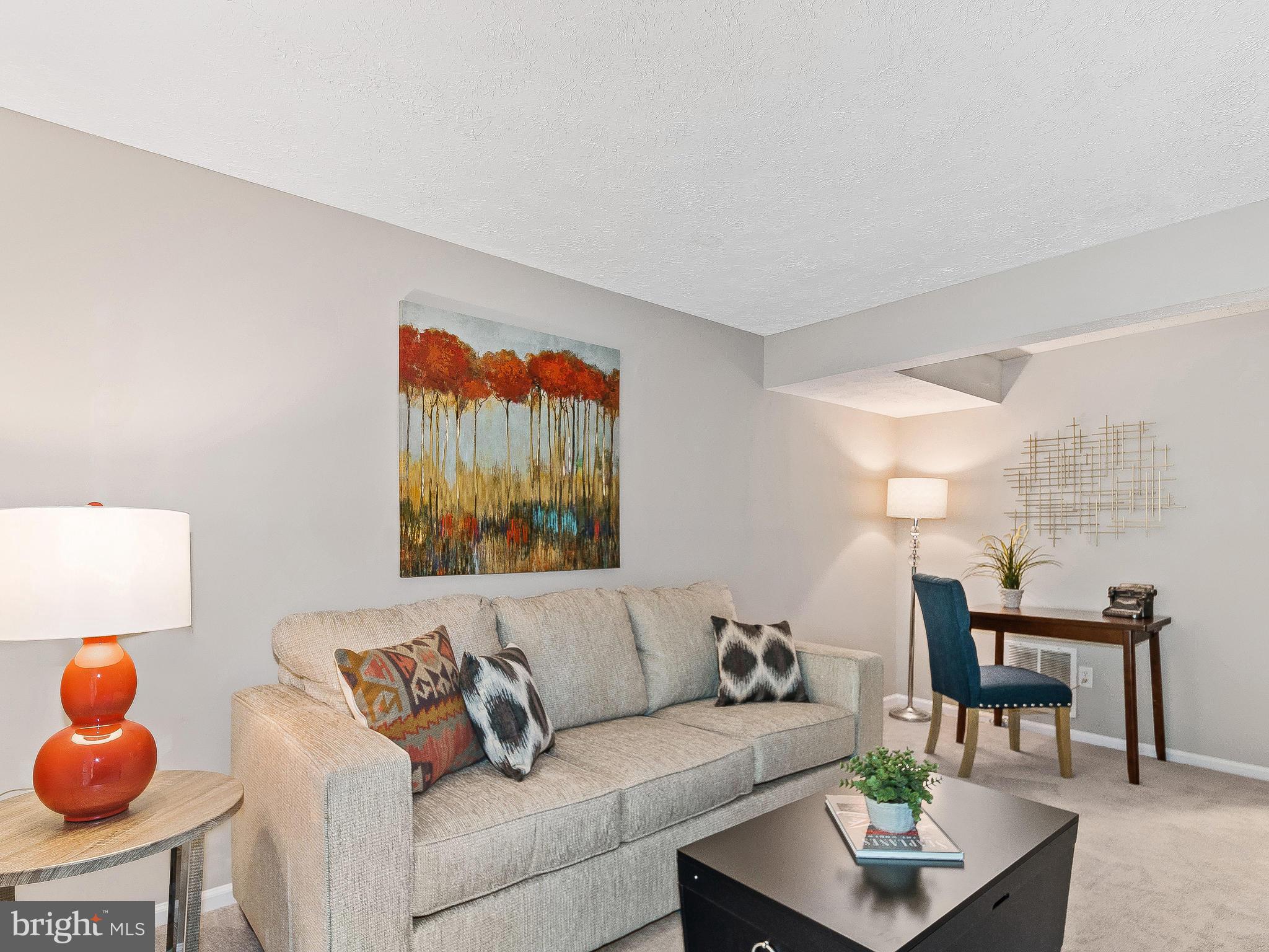 1931 Sagewood Lane Reston, VA 20191 - Photo 22 of 30 a living room with furniture and a potted plant