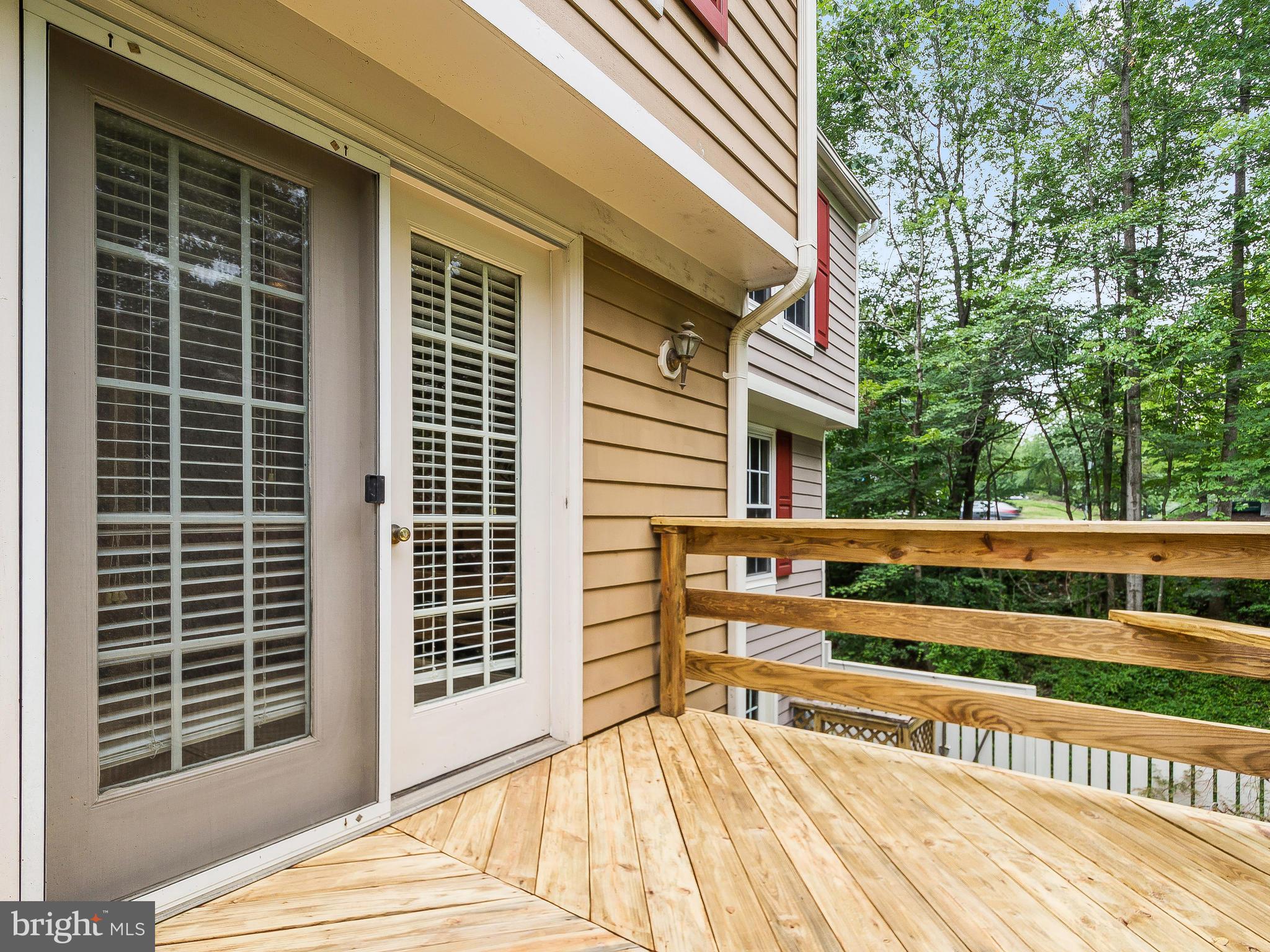 1931 Sagewood Lane Reston, VA 20191 - Photo 8 of 30 a view of backyard with a balcony and wooden floor