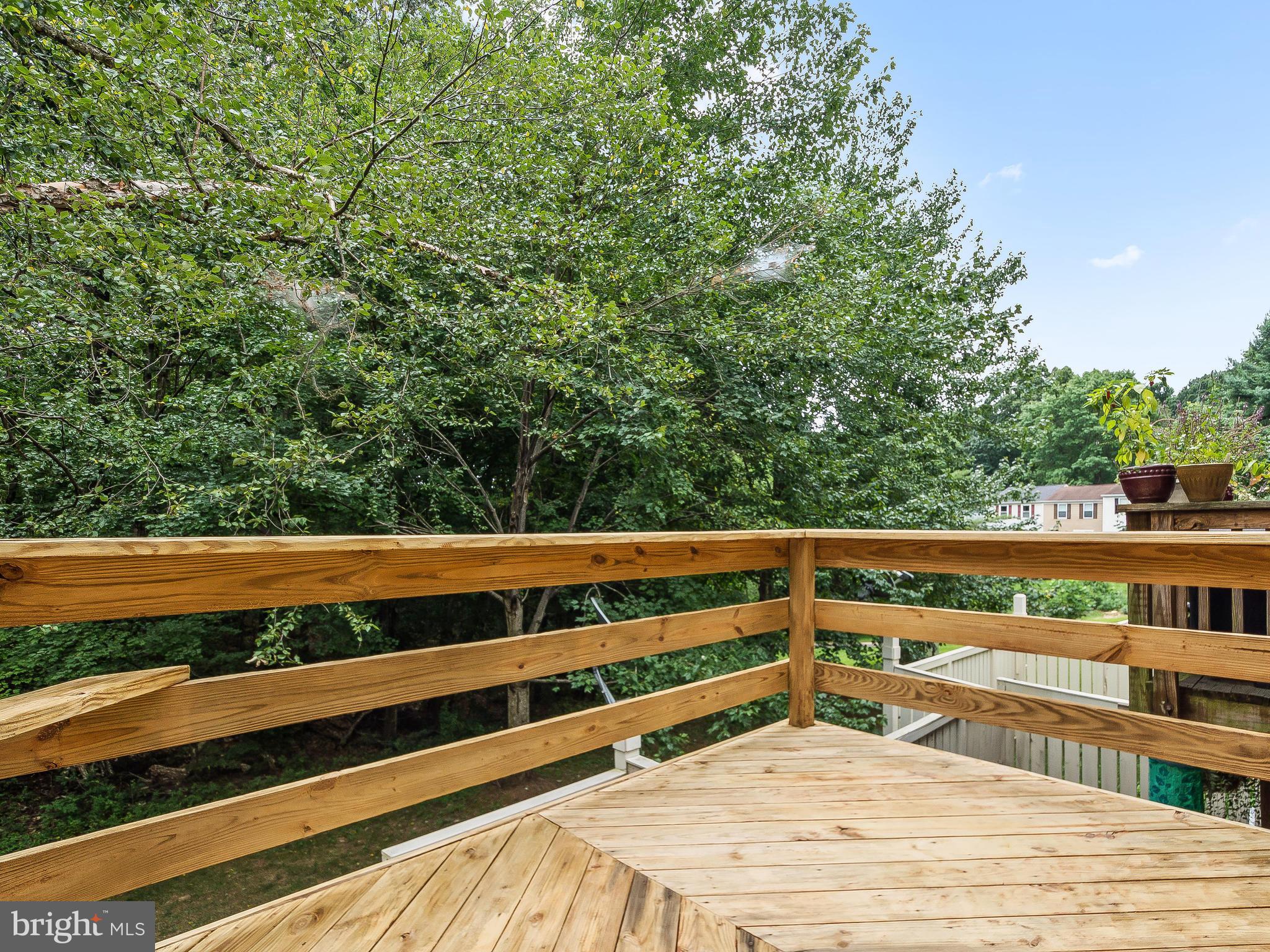 1931 Sagewood Lane Reston, VA 20191 - Photo 9 of 30 a view of balcony with wooden floor and fence