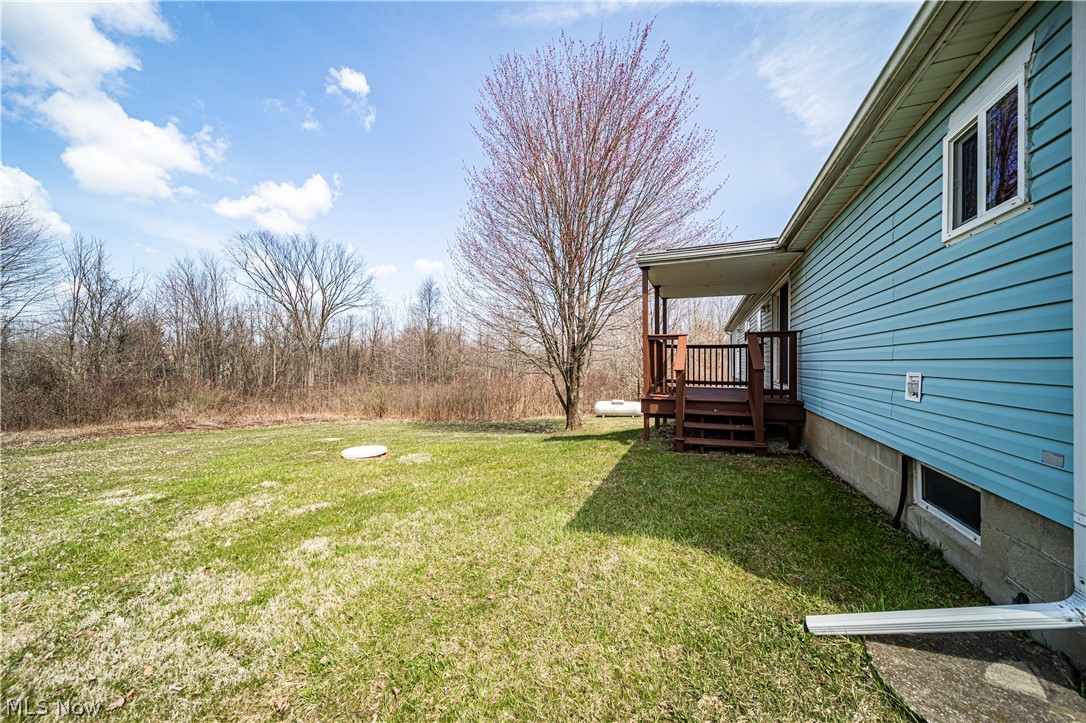 3471 Fox Road Kingsville, OH 44048 - Photo 6 of 50 View of yard featuring a wooden deck