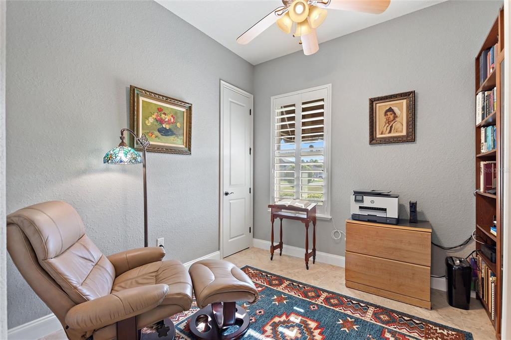 130 Laynewade Road Polk City, FL 33868 - Photo 18 of 41 a bedroom with furniture and a window