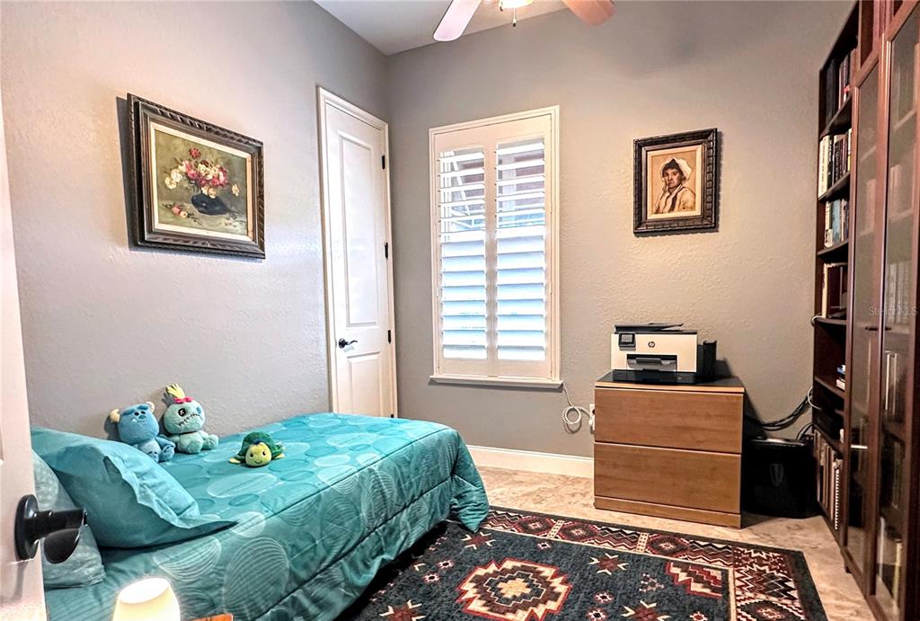 130 Laynewade Road Polk City, FL 33868 - Photo 20 of 41 a bedroom with bed and wooden floor