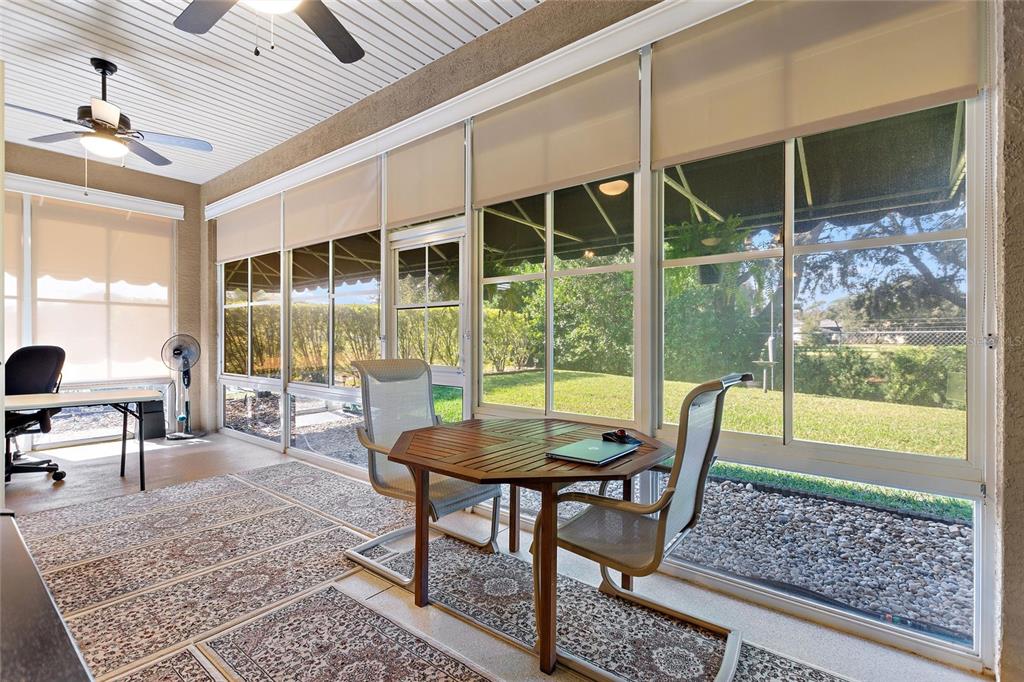 130 Laynewade Road Polk City, FL 33868 - Photo 21 of 41 a view of a dining room with furniture wooden floor and a chandelier