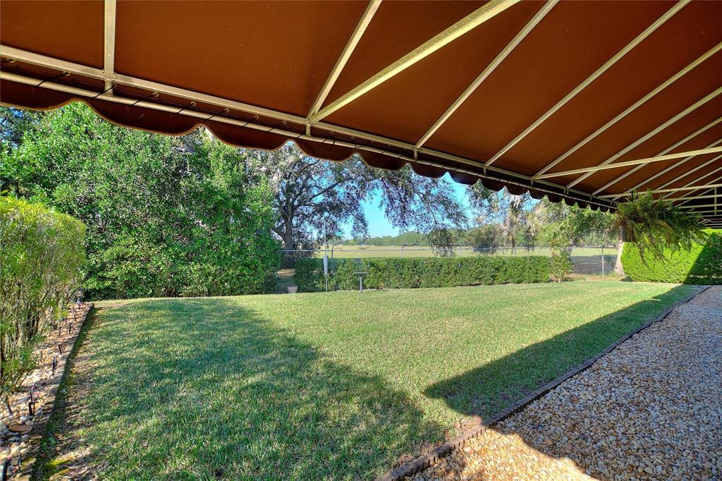 130 Laynewade Road Polk City, FL 33868 - Photo 36 of 41 a view of a backyard with garden