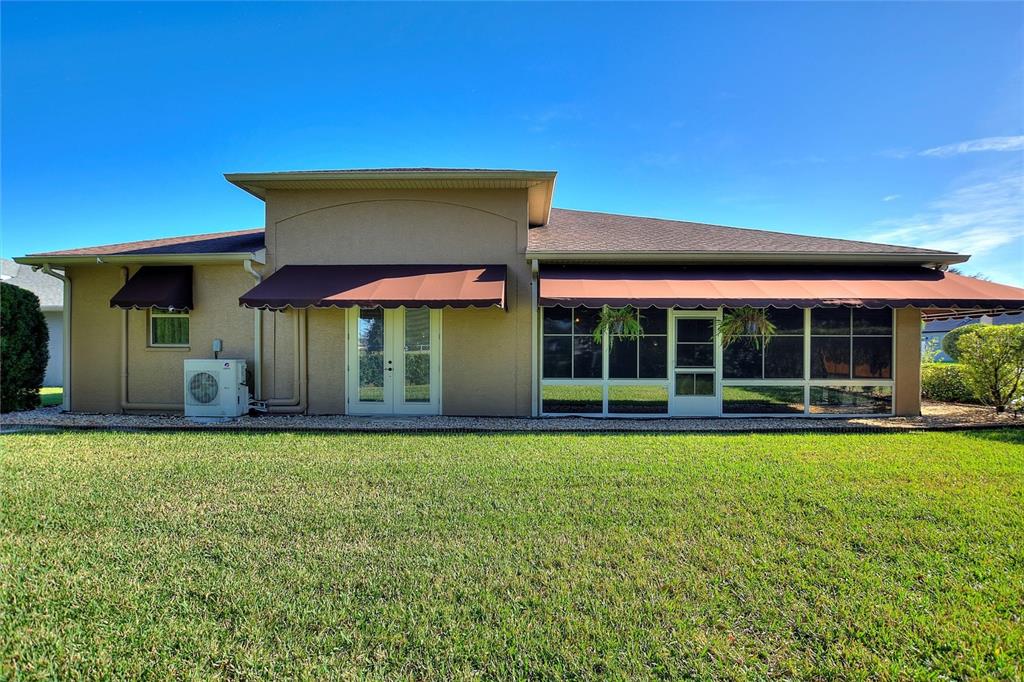 130 Laynewade Road Polk City, FL 33868 - Photo 38 of 41 a view of a house with a yard and a large tree