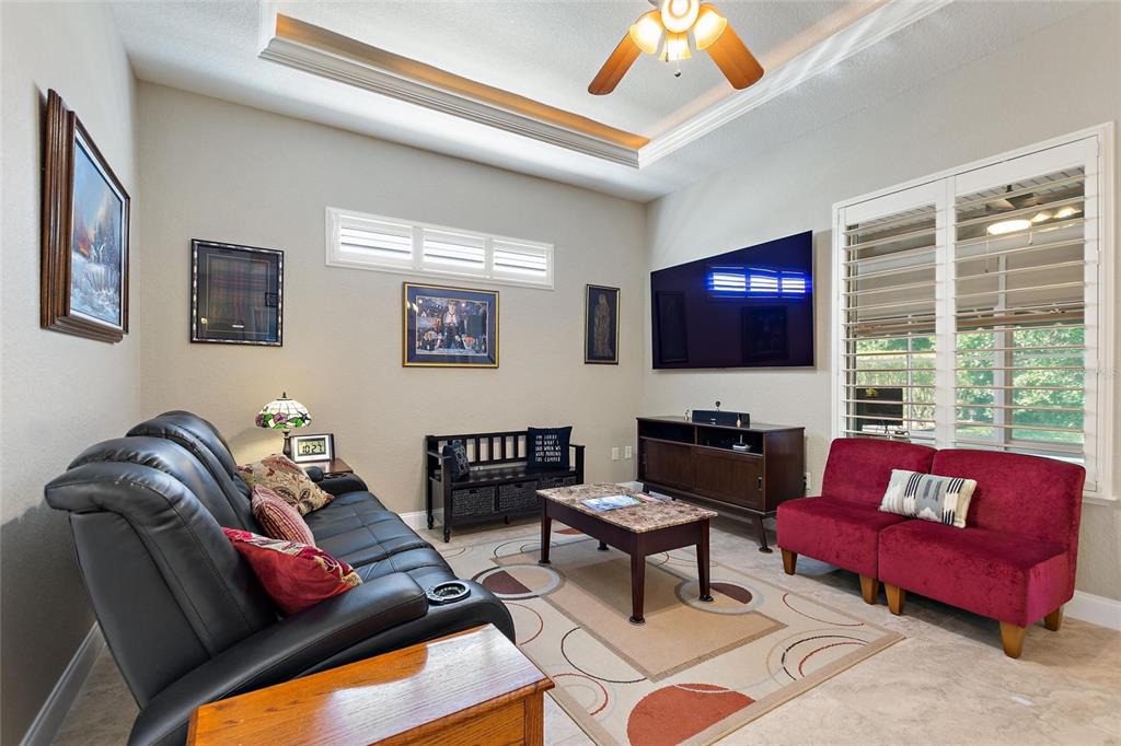 130 Laynewade Road Polk City, FL 33868 - Photo 4 of 41 a living room with furniture and a flat screen tv