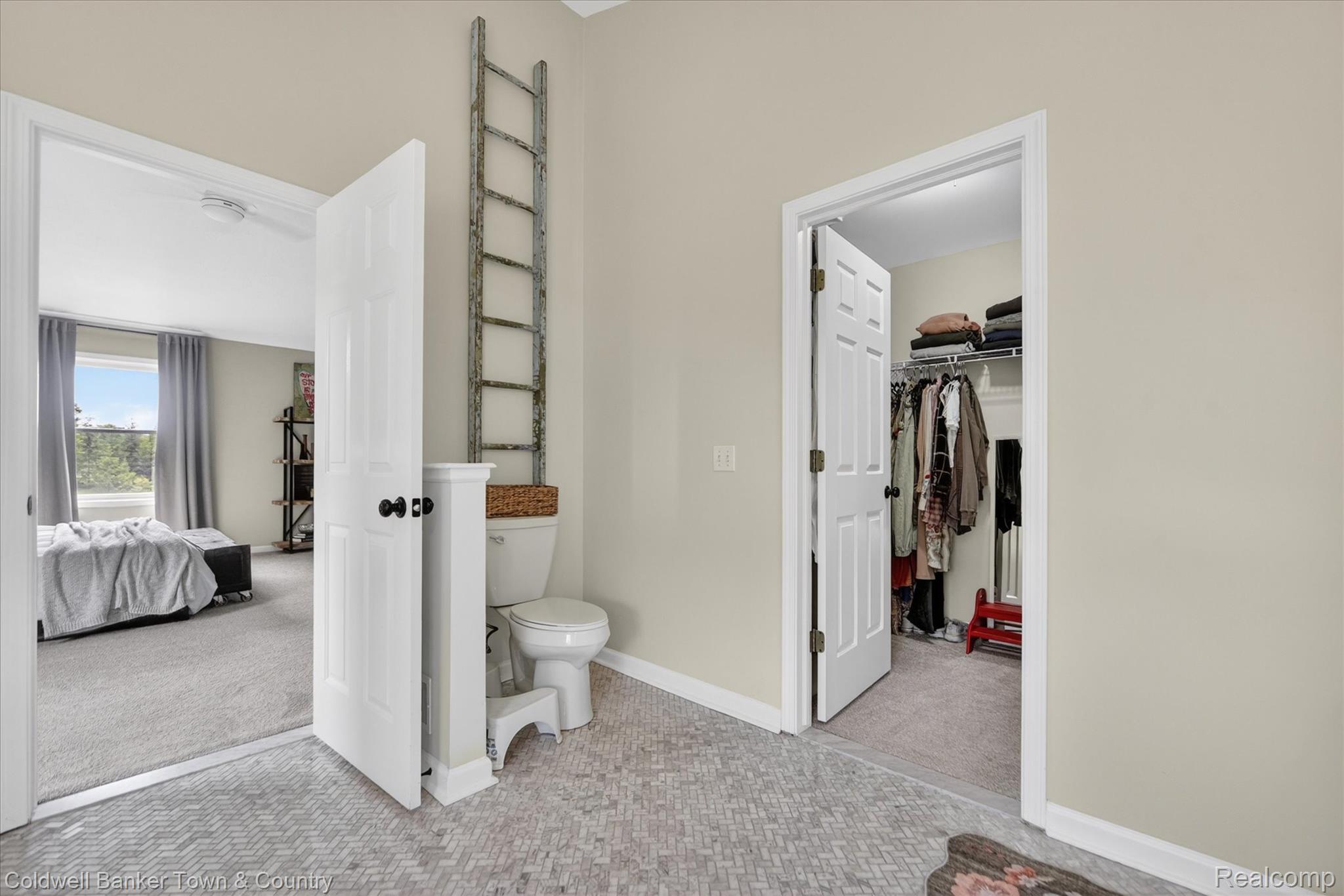 918 Gray Fox Court Howell, MI 48843 - Photo 35 of 84 Bathroom featuring a white toilet, herringbone tile flooring, and light beige walls