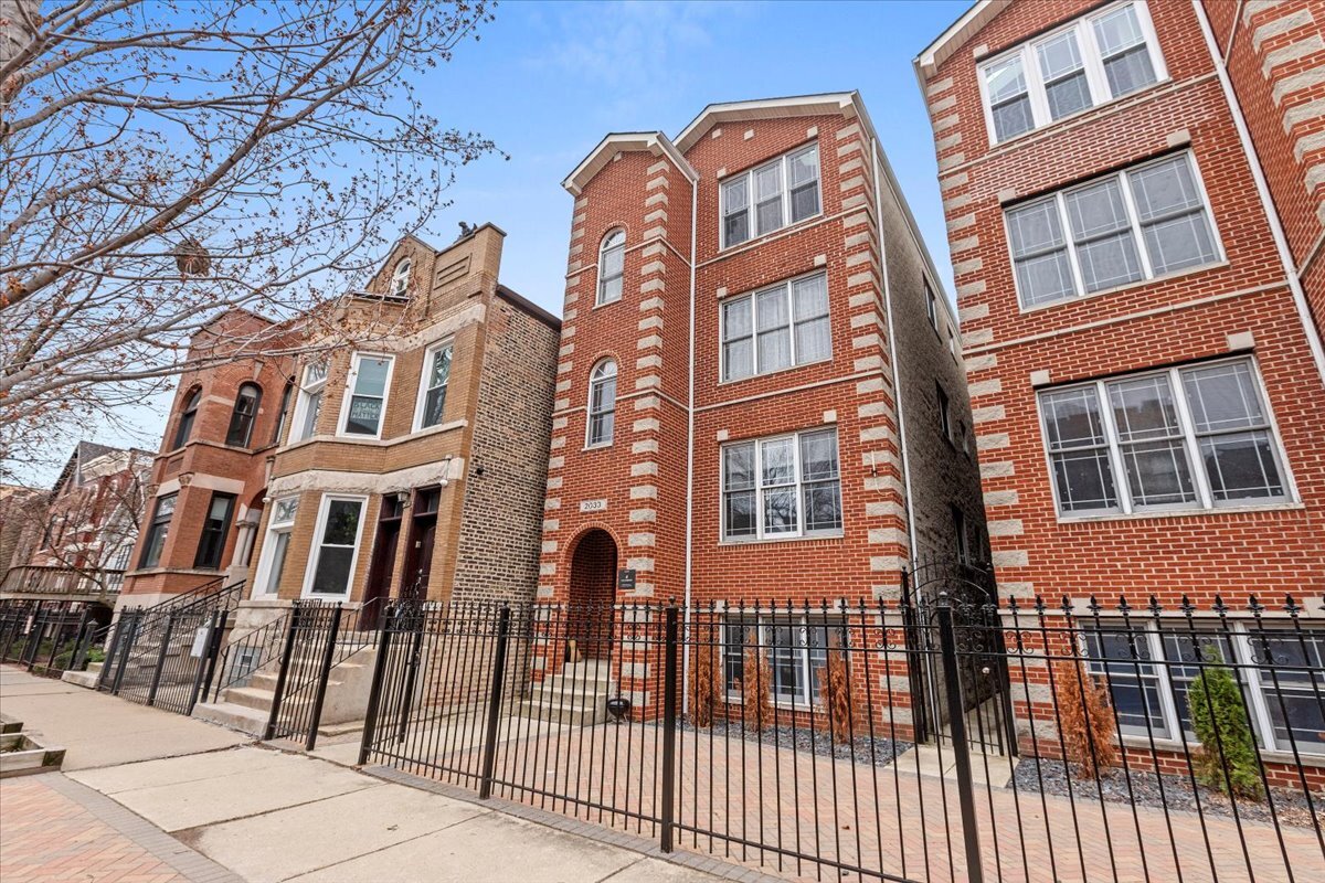 2033 West Huron Street, Unit 1 Chicago, IL 60612 - Photo 1 of 8 front view of a brick building