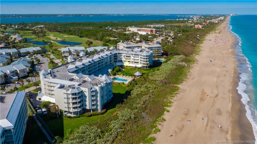 579 Northeast Plantation Road, Unit N107 Jensen Beach, FL 34957 - Photo 1 of 44 a view of a city with ocean view