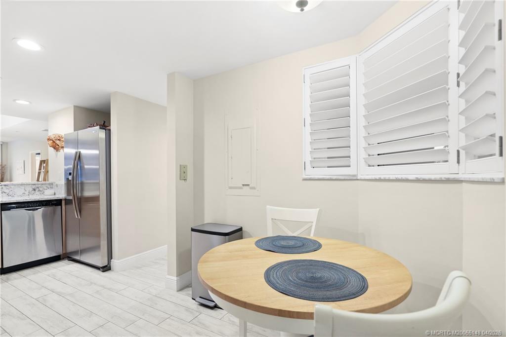 579 Northeast Plantation Road, Unit N107 Jensen Beach, FL 34957 - Photo 20 of 44 a bathroom with a sink toilet and shower