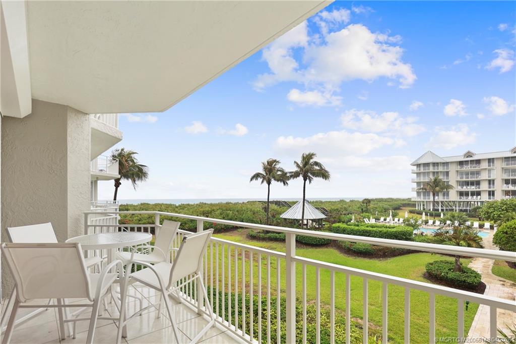 579 Northeast Plantation Road, Unit N107 Jensen Beach, FL 34957 - Photo 34 of 44 a view of a balcony with an ocean view