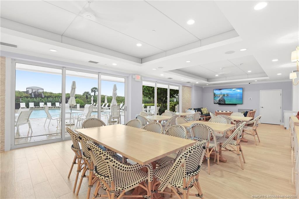 579 Northeast Plantation Road, Unit N107 Jensen Beach, FL 34957 - Photo 41 of 44 a view of a dining room with furniture window and outside view