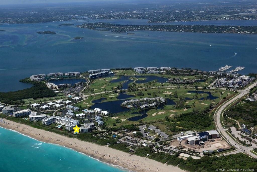 579 Northeast Plantation Road, Unit N107 Jensen Beach, FL 34957 - Photo 5 of 44 a view of a lake with a city