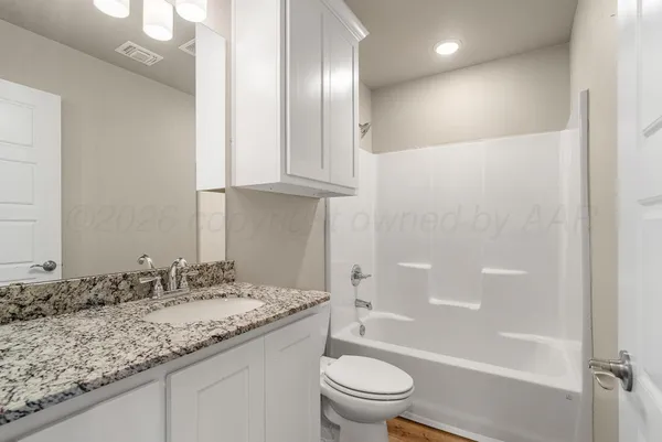 a view of a brick house with a large windows