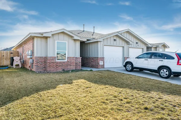 a view of a car in front of a house
