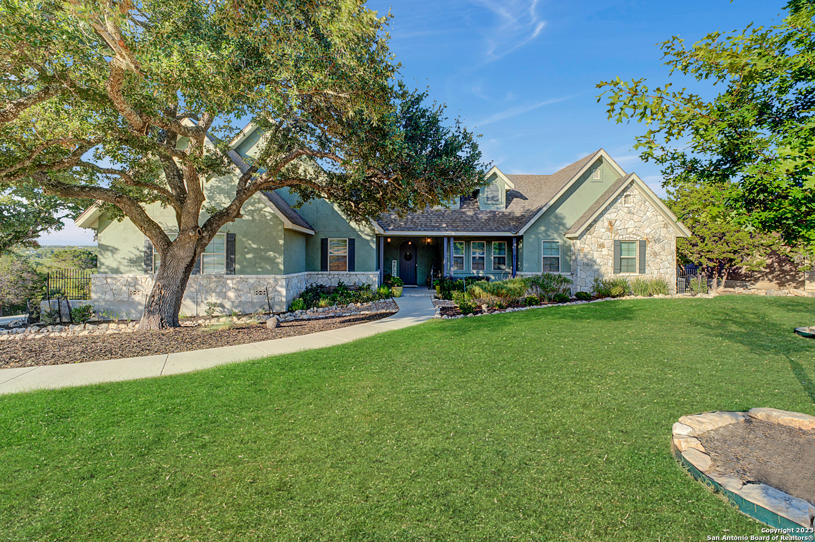 a front view of house with yard and green space