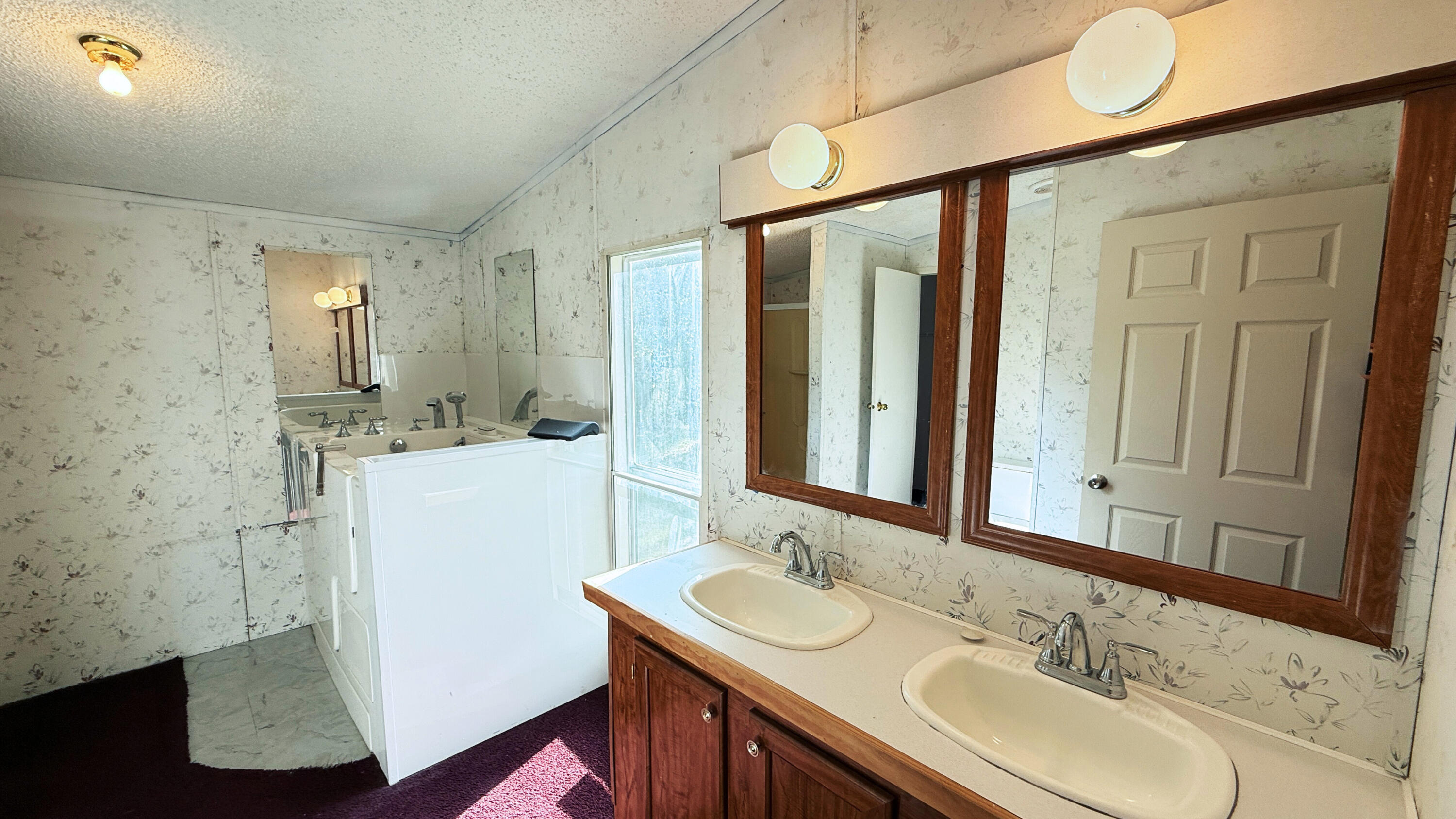 5243 Morris Street Crestview, FL 32539 - Photo 11 of 25 a bathroom with a sink and a mirror