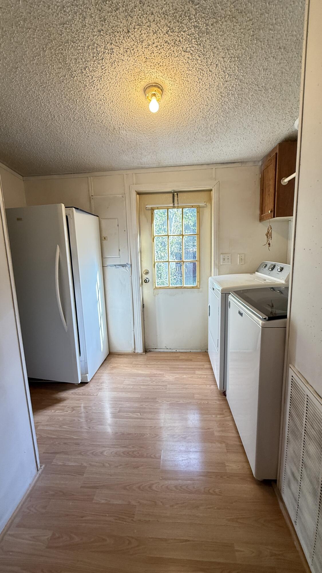 5243 Morris Street Crestview, FL 32539 - Photo 17 of 25 an empty room with windows and cabinet