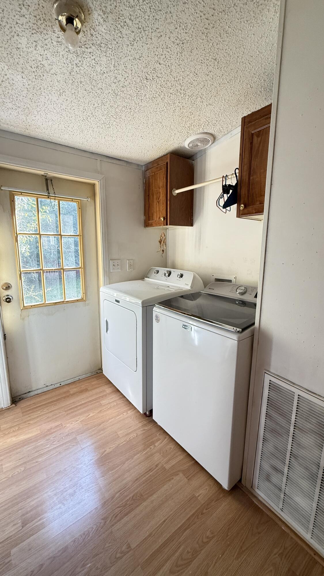 5243 Morris Street Crestview, FL 32539 - Photo 18 of 25 a view of a kitchen with sink dishwasher and a refrigerator