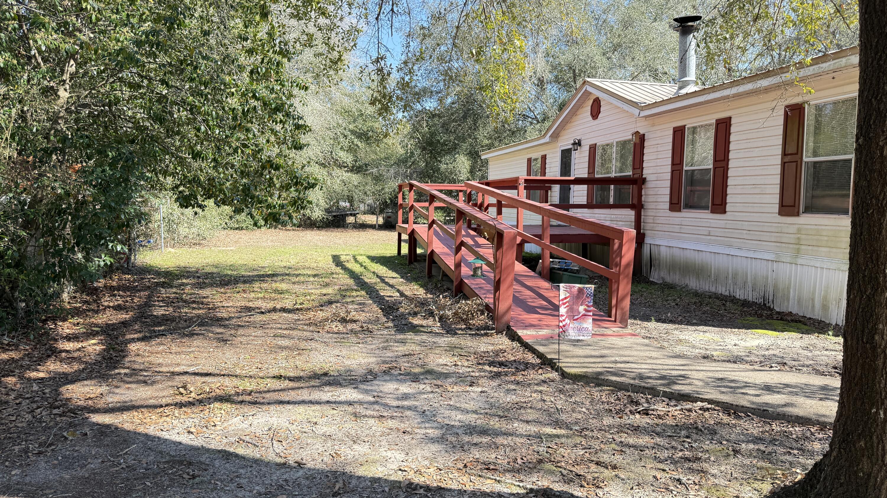 5243 Morris Street Crestview, FL 32539 - Photo 19 of 25 a view of a house with a yard