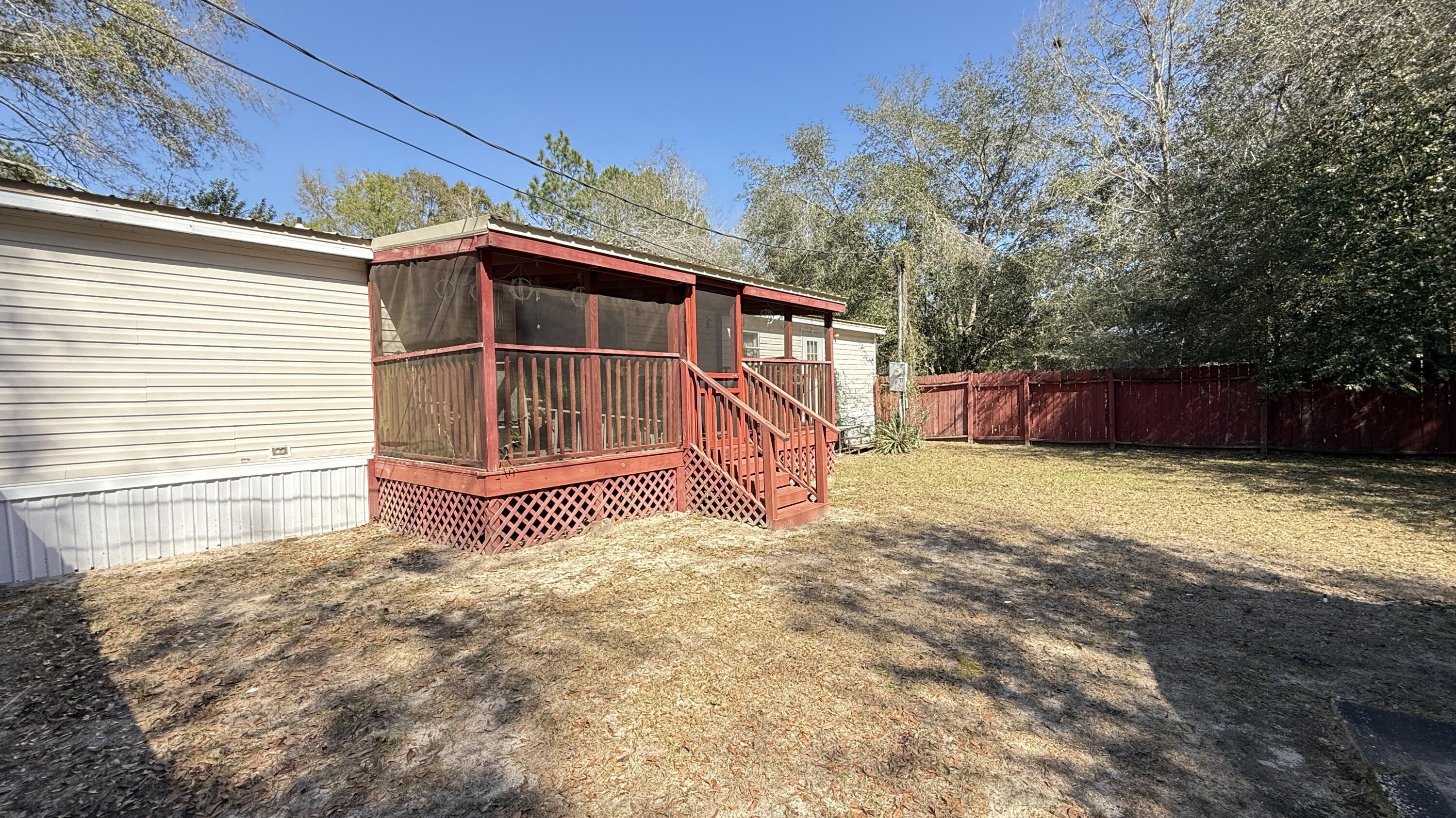 5243 Morris Street Crestview, FL 32539 - Photo 22 of 25 a front view of a house with a yard