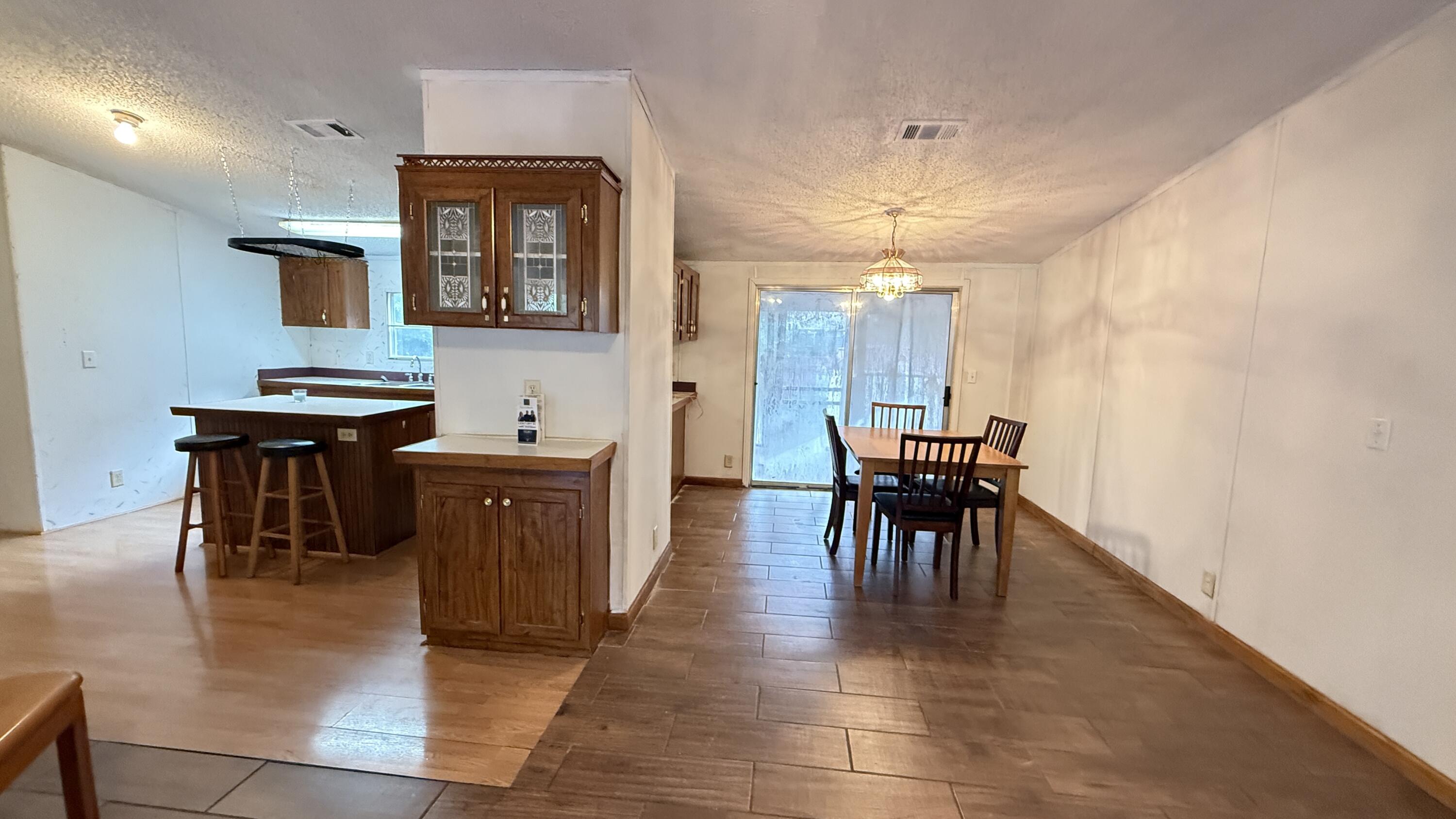 5243 Morris Street Crestview, FL 32539 - Photo 6 of 25 a view of a dining room with furniture