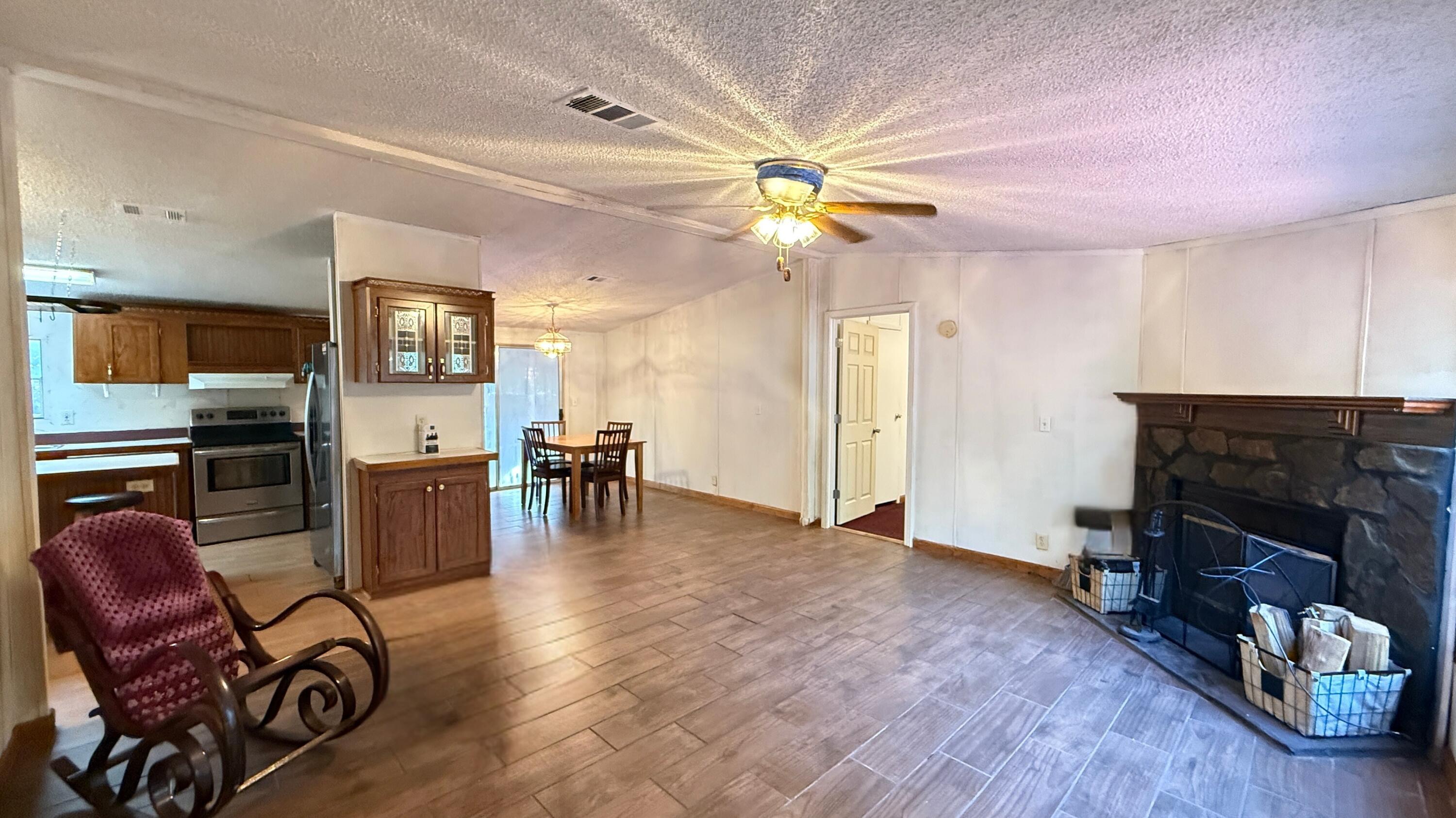 5243 Morris Street Crestview, FL 32539 - Photo 8 of 25 a view of a livingroom with furniture and a ceiling fan