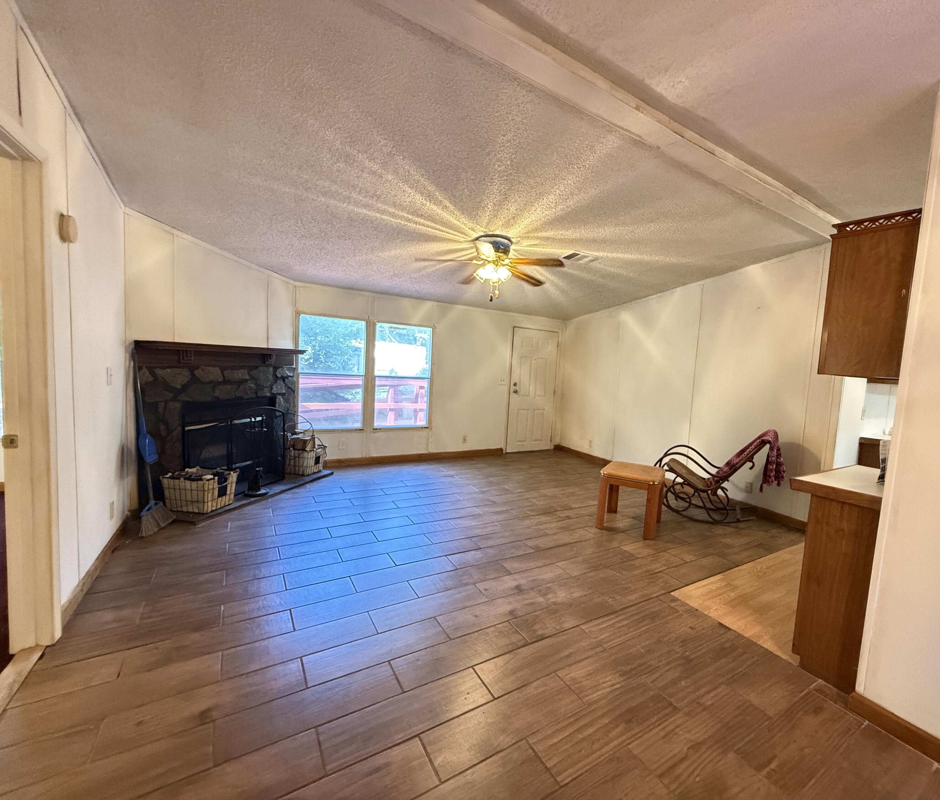 5243 Morris Street Crestview, FL 32539 - Photo 9 of 25 a living room with furniture and a fireplace