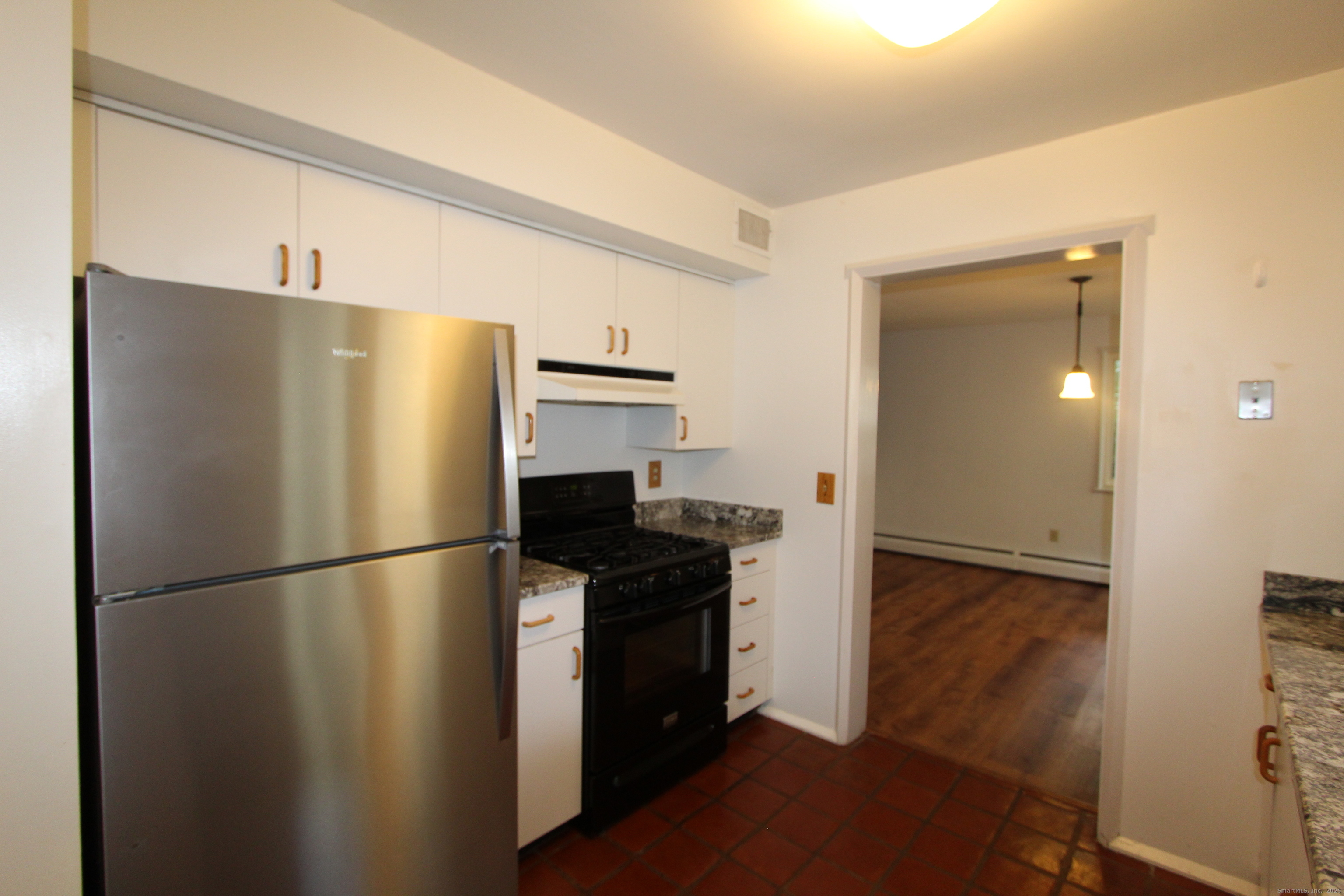 6 Lyle Court, Unit C Farmington, CT 06032 - Photo 11 of 34 a kitchen with stainless steel appliances a refrigerator and a sink