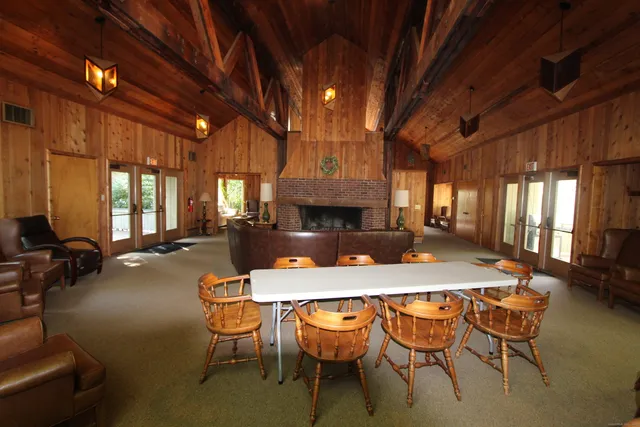 a view of a dining room with furniture and window