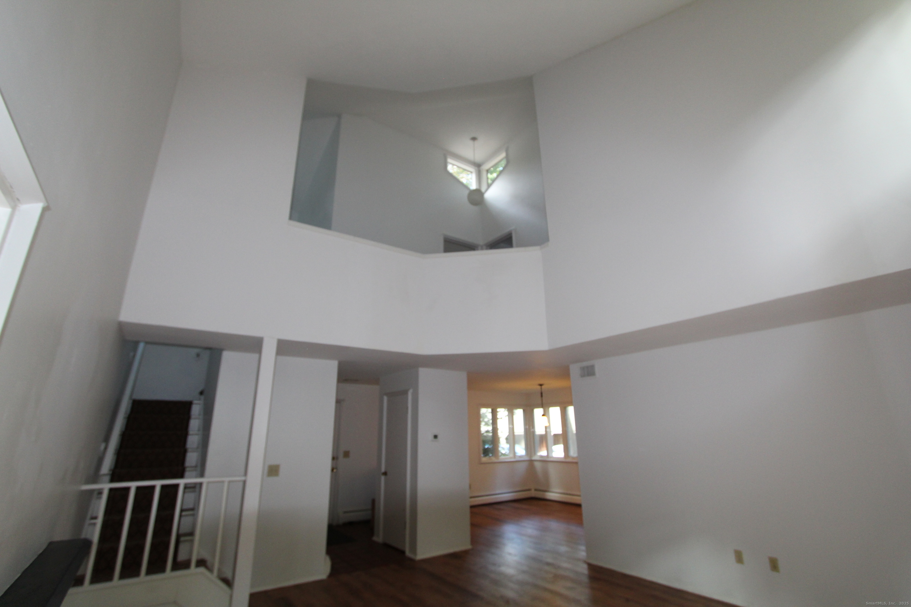 6 Lyle Court, Unit C Farmington, CT 06032 - Photo 25 of 34 wooden floor in an empty room with a window