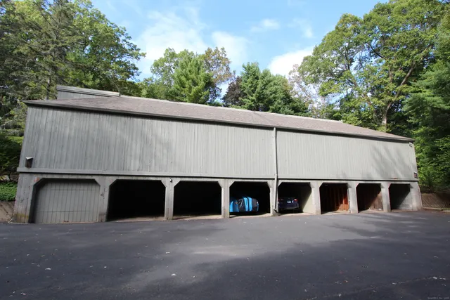 a couple of table and chairs under an umbrella