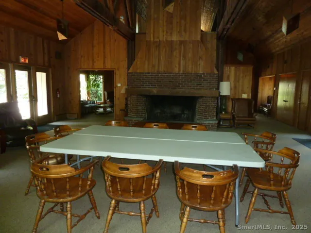 a view of a dining room with furniture and window